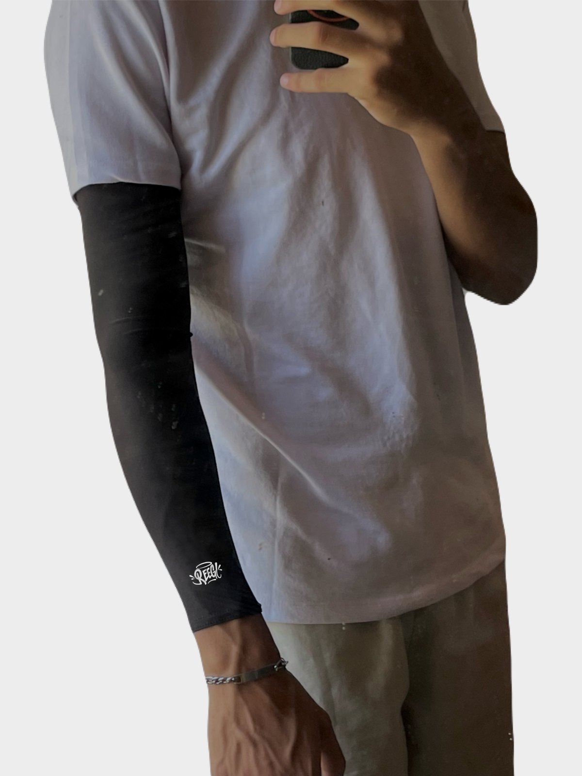 The arm sleeve worn under a white tee
